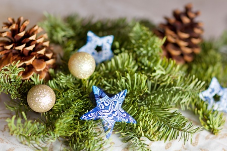 christmas decoration with tree branches, stars and tree conesの写真素材