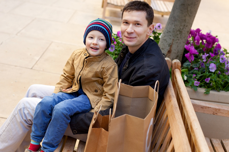 cheerful family of two shopping togetherの写真素材