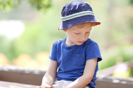 unhappy upset little boy looking awayの写真素材