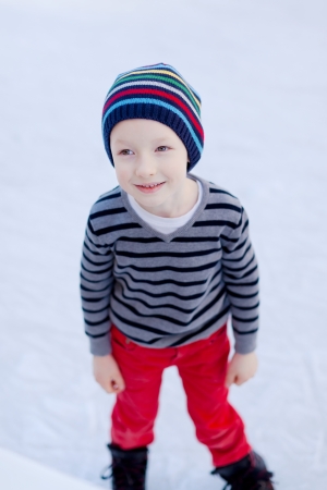 cute little boy enjoying ice skatingの写真素材