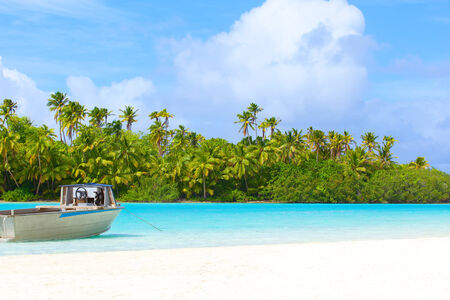 view at picture perfect island and the boat in the turquoise lagoonの写真素材