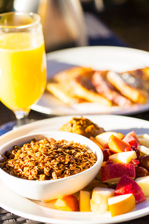 healthy breakfast of granola, fruits and orange juiceの写真素材