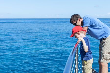 family of two at the boat looking at waterの写真素材