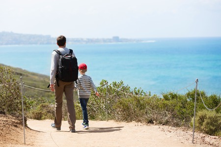 young active family of two hiking in torrey pines state natural reserve, concept of active and healthy lifestyleの写真素材