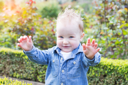 adorable smiling toddler boy in the parkの写真素材