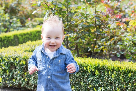 adorable smiling toddler boy in the parkの写真素材