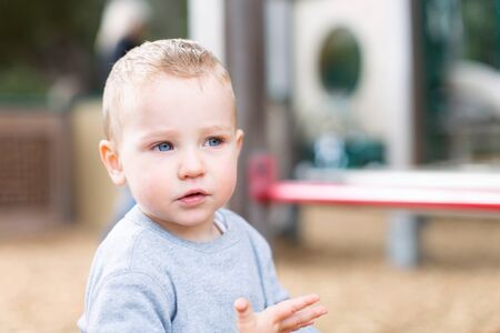 adorable toddler being playful and enjoying time at the playgroundの写真素材