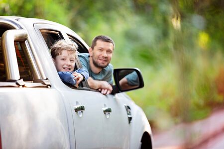 family of two, father and son, enjoying road trip in subtropical rainforest in misiones province in argentina, family adventure conceptの写真素材
