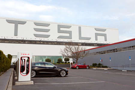 Fremont, CA - January 25, 2020: Tesla model S charging at supercharger station at Tesla factory in Fremont, the only Tesla factory in USAのeditorial素材