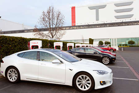 Fremont, CA - January 25, 2020: Tesla model S charging at supercharger station at Tesla factory in Fremont, the only Tesla factory in USAのeditorial素材