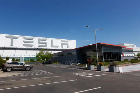 Fremont, CA - May 1, 2020: Tesla model y charging at supercharger station at Tesla factory in Fremont during plant closure due to coronavirus (covid-19) pandemic, the only Tesla factory in USAのeditorial素材