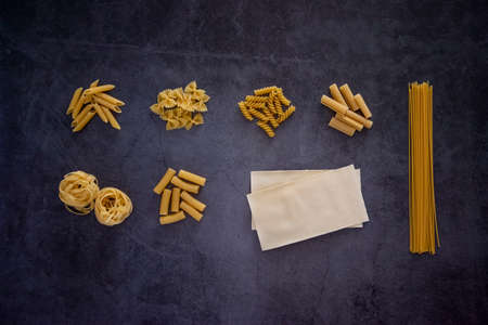 Different types of pasta including penne, fusilli, farfalle, spaghetti, lasagne, tagliatelle,...