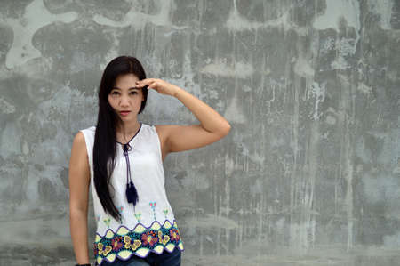 Model Women Half Portrait with The background is gray wall.の写真素材