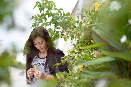 Model Women Half Portrait with Flowers and Gardenの写真素材