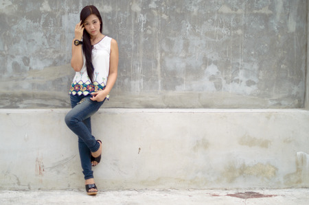 Model Women Portrait with The background is gray wall.の写真素材