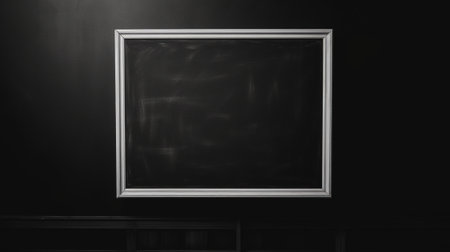 blank blackboard with white frame on black wall background, copy spaceの素材