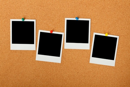 Cork bulletin board with blank instant print pictures