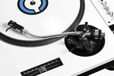 Closedup of white turntable with white vinyl