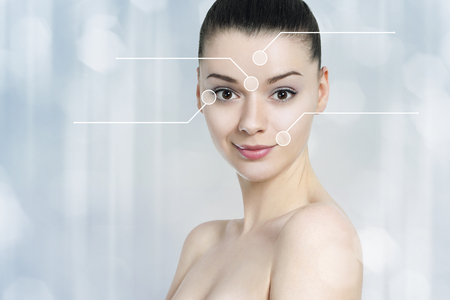 Beautiful brunette woman pointed wrinkles spots. Anti agingtreatment  - conceptの写真素材