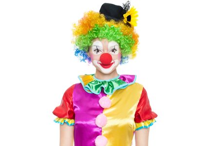 Beautiful young woman as funny clown - colorful portraitの写真素材