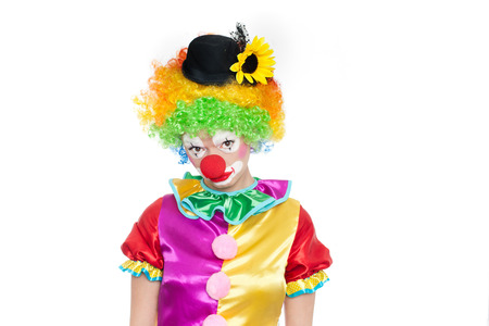 Beautiful young woman as sad clown - colorful portraitの写真素材