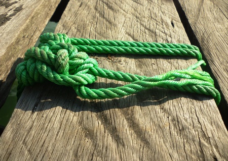  Nautical knot tied in on wooden bridgeの写真素材