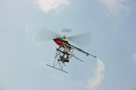 aeromodelling helicopters are flying off on the skyの写真素材