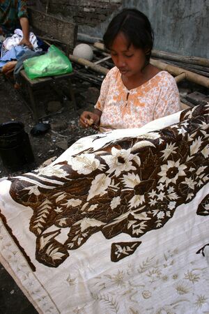 CIREBON-JULY 30  women making traditional batik cloth at the home industry on July 30, 2008 in Cirebonのeditorial素材