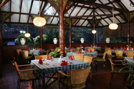 details of dinning tables of Indonesian restaurant in yellow tonesのeditorial素材