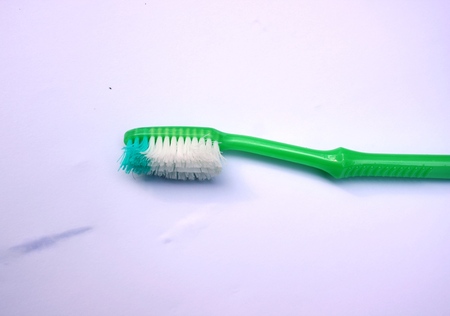  the broken toothbrush isolated on a white background