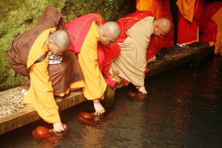 Buddhist prayer procession in the holy water when taking Jumprit ,Temanggung, Central Java , Indonesiaのeditorial素材