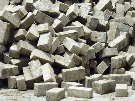 pile of grey cubical shaped granite cobblestonesの写真素材