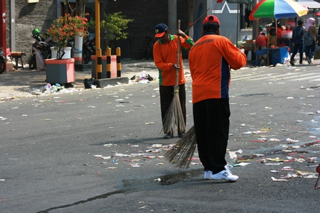 Street Sweeper Sweeping Pavement in Blora, central java, indonesiaのeditorial素材
