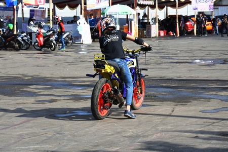 attractions daring freestyle of motorcycle rider, asian, indonesia