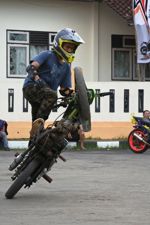 attractions daring freestyle of motorcycle rider, asian, indonesiaのeditorial素材
