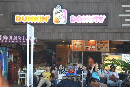 Juanda International Airport, Indonesia - September 23, 2017: Dunkin donuts fast food restaurant at the airport terminalのeditorial素材