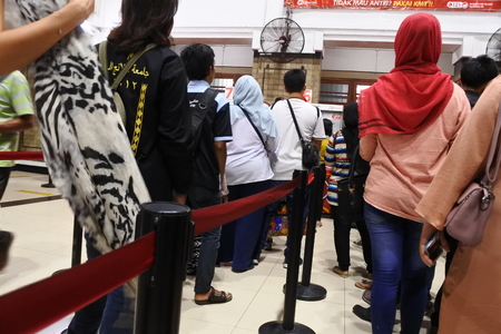 Jakarta November 4, 2017: passenger commuter line passengers buy a passenger card at the jakarta kota stationのeditorial素材