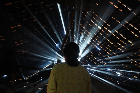 ray of light passes through the roof of the houseの写真素材