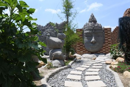 statue of Budha head, Central Java, Indonesiaの写真素材