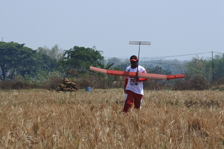 freefly aeromodeling hobbyists at the contest at Ngloram Airport, Cepu, central Java, Indonesiaのeditorial素材