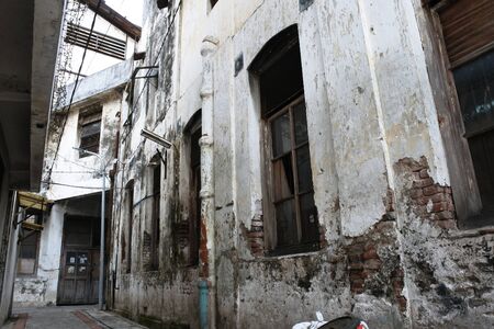 the narrow alley of the old city of Surabayaの写真素材