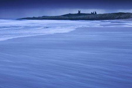 Dunstanburgh Castle, Northumberland before the dawnの写真素材