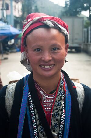 9 Dec 2009, Sapa, Vietnam: A woman from the Red Dao ethnic minority, dressed in her ethnic garb, in the mountain region of Sapa, in Lao Cai province of Vietnam.のeditorial素材