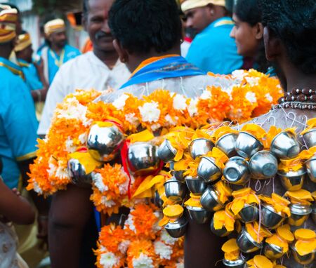 20 January 2011, Kuala Lumpur, Malaysia:  Hindu devotees carrying miniature milk pots on hooks embedded in their backs as part of the Thaipusam festival.のeditorial素材