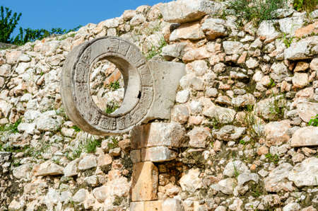 Close up of the scoring hoop of the ancient Mayan Great Mesoamerican Ball Game court in Uxmal, Mexico.のeditorial素材