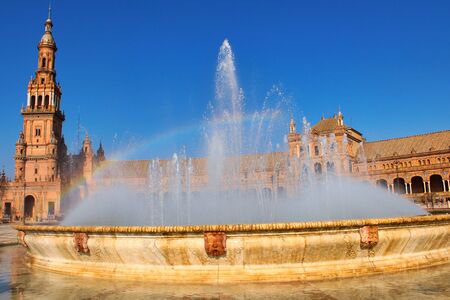 Impressive rainbow in the fountain water of an historical squareの写真素材