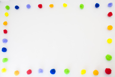frame of different colours examples of pompomsの写真素材