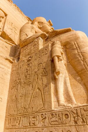 to vertical view of a detail of a relief of the Colossus of Abu Simbel, Nubia, Egypt