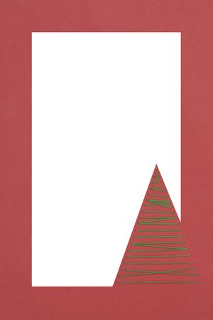 a vertical overhead view of a Christmas greeting made by a thread tree with a white spaceの写真素材