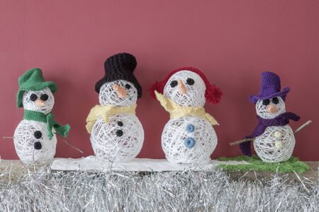 a horizontal frontal view of a xmas decorated fireplace with snowmen with space for a messageの写真素材